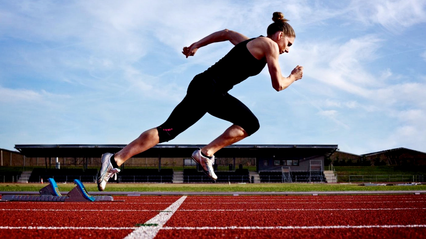 woman running on  a track